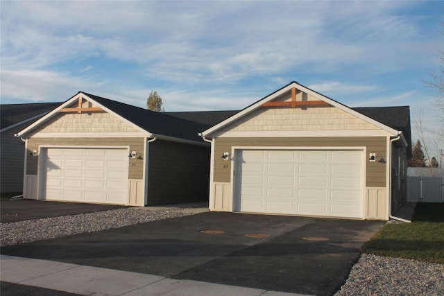 view of front of house featuring a garage and an outdoor structure