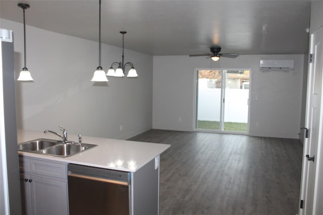 kitchen with a wall unit AC, dishwasher, sink, and hanging light fixtures