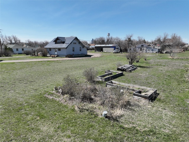 116 3rd Ave NE, Dutton, MT 59433 - view of grassy yard featuring a garden