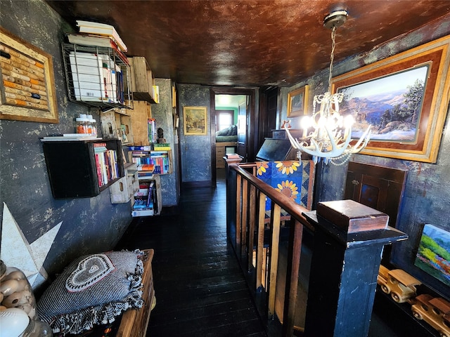 interior space with dark hardwood / wood-style flooring and an inviting chandelier