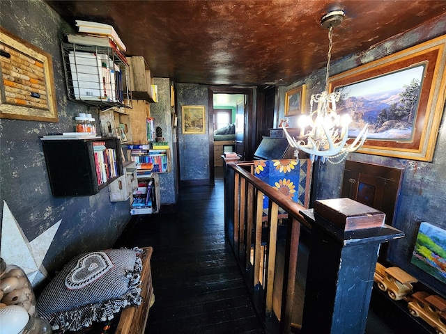 116 3rd Ave NE, Dutton, MT 59433 - corridor featuring hardwood / wood-style flooring, a chandelier, and an upstairs landing