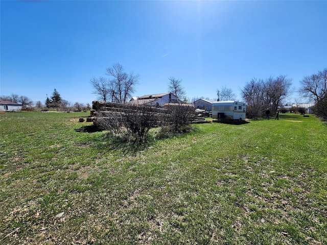 view of yard with a rural view