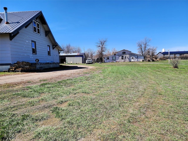 116 3rd Ave NE, Dutton, MT 59433 - view of green lawn featuring dirt driveway