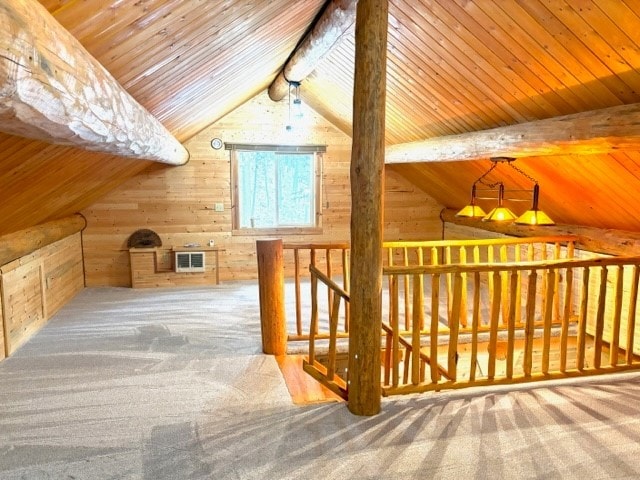 bonus room featuring vaulted ceiling with beams, wooden ceiling, wood walls, and carpet floors