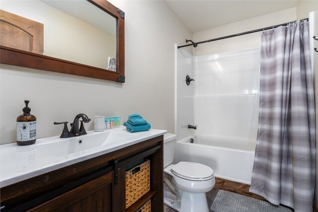 full bathroom with shower / bath combination with curtain, toilet, parquet floors, and vanity