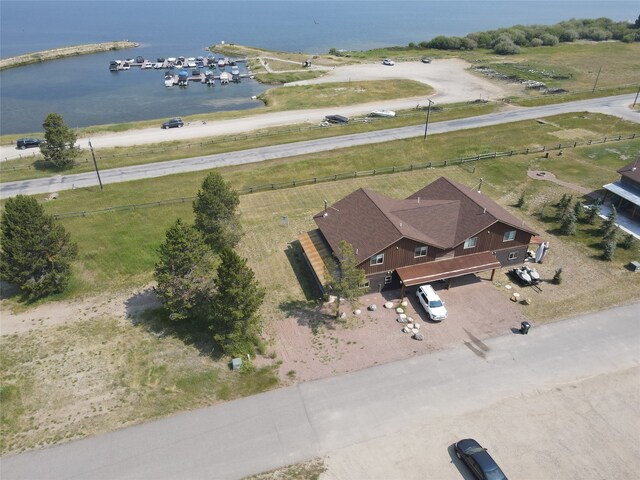 birds eye view of property featuring a water view