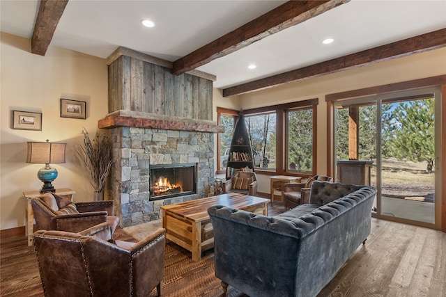 87 Rusty Iron Way, Eureka, MT 59917 - living room featuring beamed ceiling, hardwood / wood-style floors, and a stone fireplace