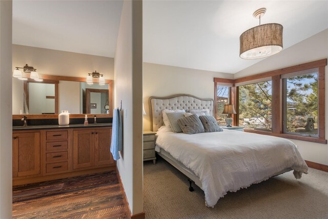 87 Rusty Iron Way, Eureka, MT 59917 - bedroom featuring vaulted ceiling and dark carpet