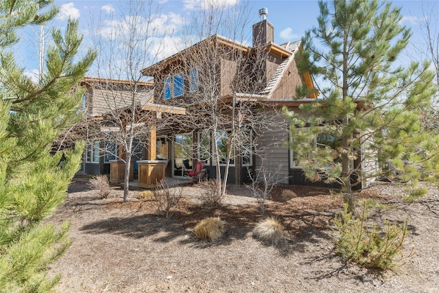 87 Rusty Iron Way, Eureka, MT 59917 - rear view of house featuring a chimney