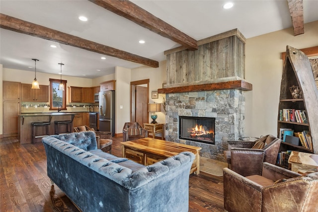 87 Rusty Iron Way, Eureka, MT 59917 - living area featuring beam ceiling, dark wood finished floors, a fireplace, and recessed lighting
