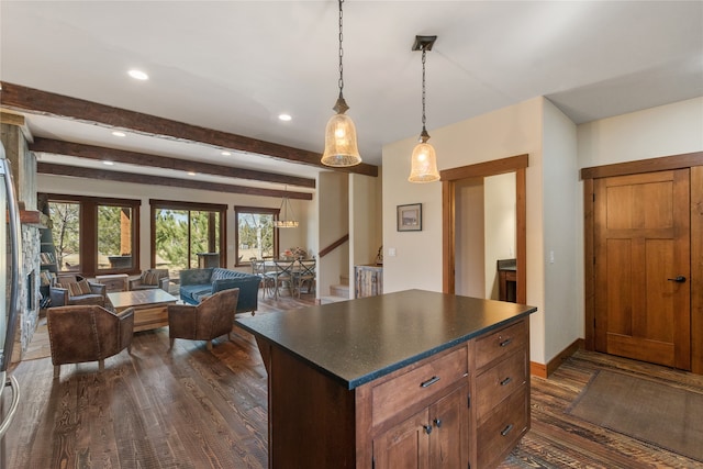 87 Rusty Iron Way, Eureka, MT 59917 - kitchen featuring pendant lighting, beam ceiling, dark wood-type flooring, and a center island