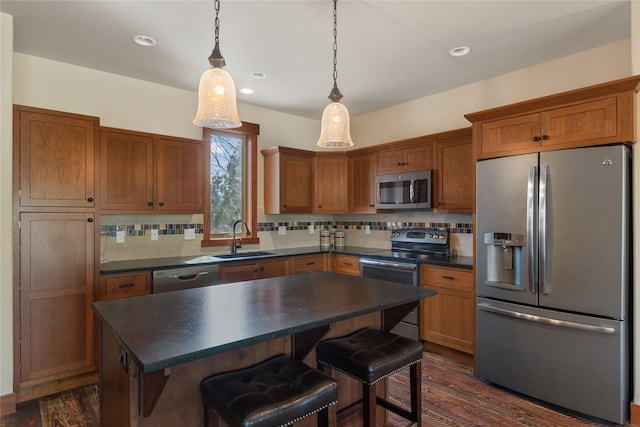 87 Rusty Iron Way, Eureka, MT 59917 - kitchen featuring stainless steel appliances, dark hardwood / wood-style floors, sink, and tasteful backsplash