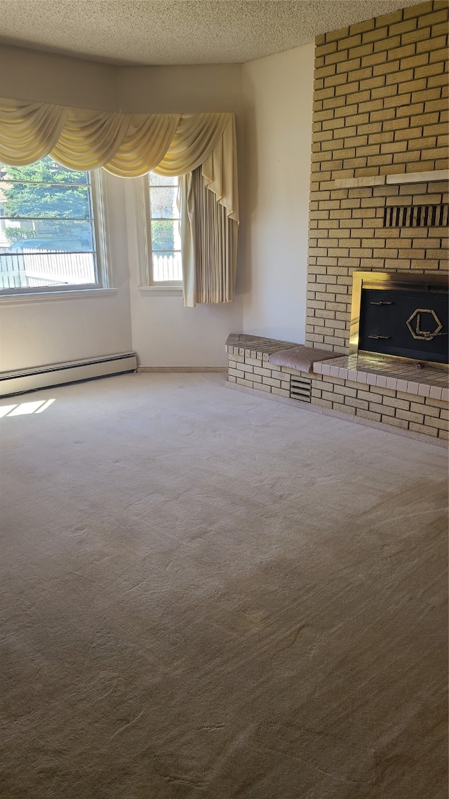 unfurnished living room featuring a fireplace, carpet floors, and a textured ceiling