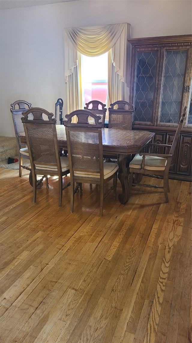 dining area featuring hardwood / wood-style flooring