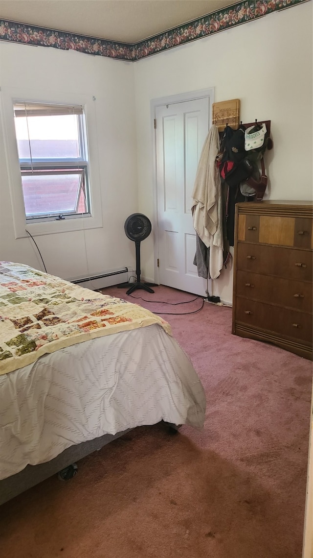 bedroom featuring light carpet and a baseboard radiator