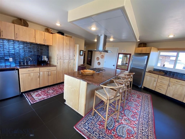 kitchen featuring light brown cabinets, backsplash, stainless steel appliances, island range hood, and dark tile flooring