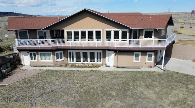 rear view of property featuring a patio