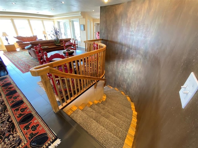 stairway featuring light tile floors