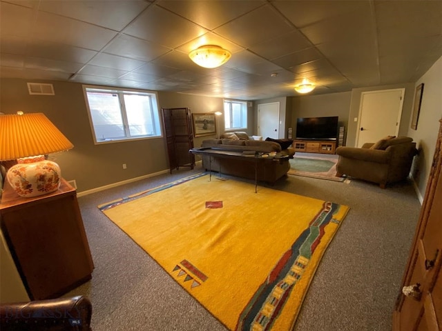 bedroom with a paneled ceiling and carpet floors