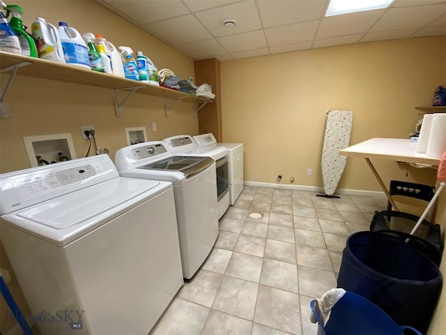 washroom featuring separate washer and dryer, light tile flooring, and washer hookup