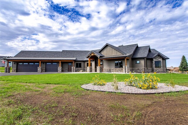 114 Pheasant Ridge Ct, Polson, MT 59860 - craftsman-style house with stone siding, a front yard, an attached garage, and board and batten siding