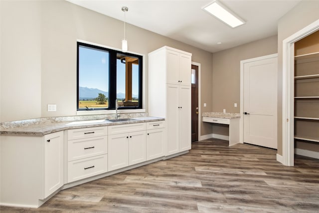 bathroom with vanity, a mountain view, and hardwood / wood-style floors