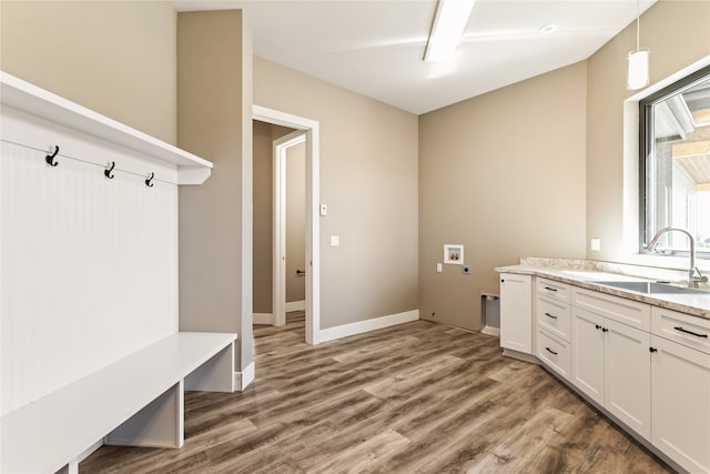 mudroom with hardwood / wood-style floors and sink