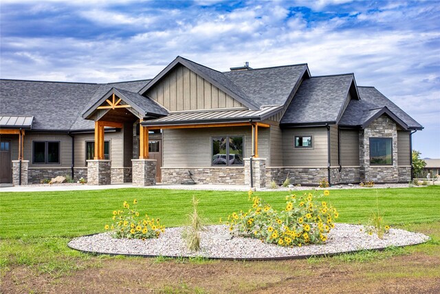 114 Pheasant Ridge Ct, Polson, MT 59860 - craftsman-style home featuring stone siding and a front yard