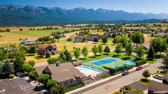 birds eye view of property with a mountain view