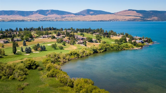 drone / aerial view with a water and mountain view