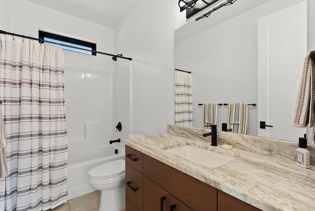 bathroom featuring shower / bath combo with shower curtain, vanity, toilet, and tile patterned floors