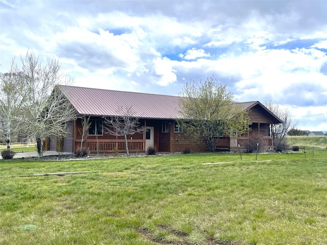 view of front of house featuring covered porch and a front lawn