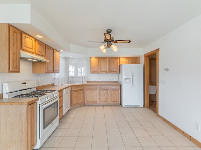 kitchen featuring light brown cabinets, ceiling fan, white appliances, light tile flooring, and sink