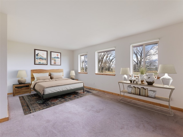 carpeted bedroom with multiple windows