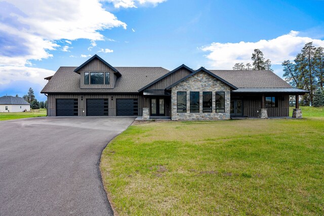 craftsman-style home with a garage and a front yard