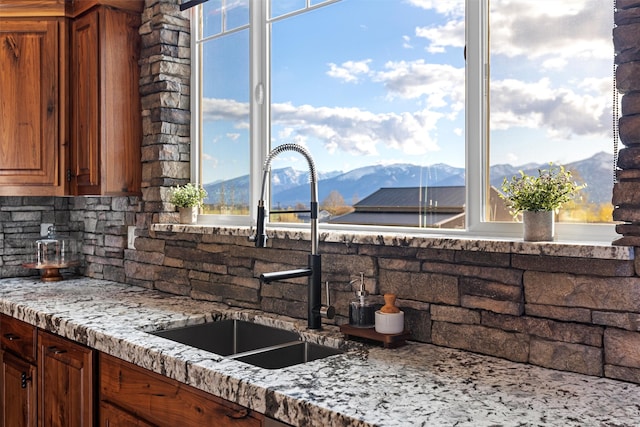 kitchen with a mountain view and sink