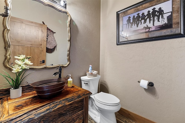 828AND806 Corvallis Hills Dr, Corvallis, MT 59828 - bathroom with vanity, a textured wall, and wood finished floors