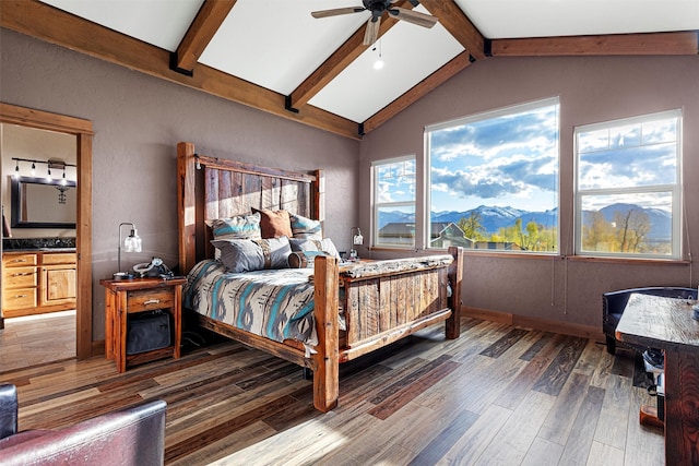 bedroom with vaulted ceiling with beams, a mountain view, multiple windows, and dark hardwood / wood-style flooring