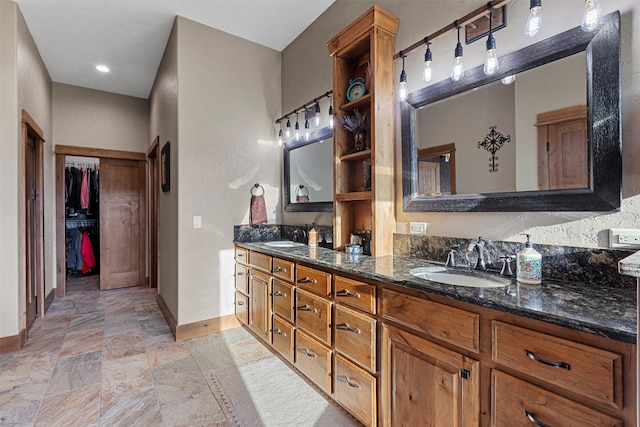 bathroom with tile flooring and dual vanity