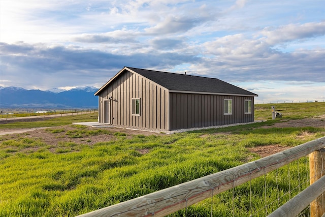 view of side of property featuring a mountain view and a rural view