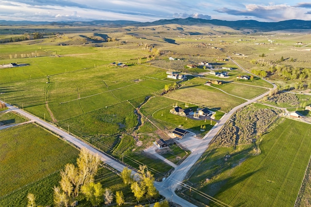 aerial view with a mountain view and a rural view