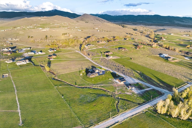 birds eye view of property with a mountain view and a rural view