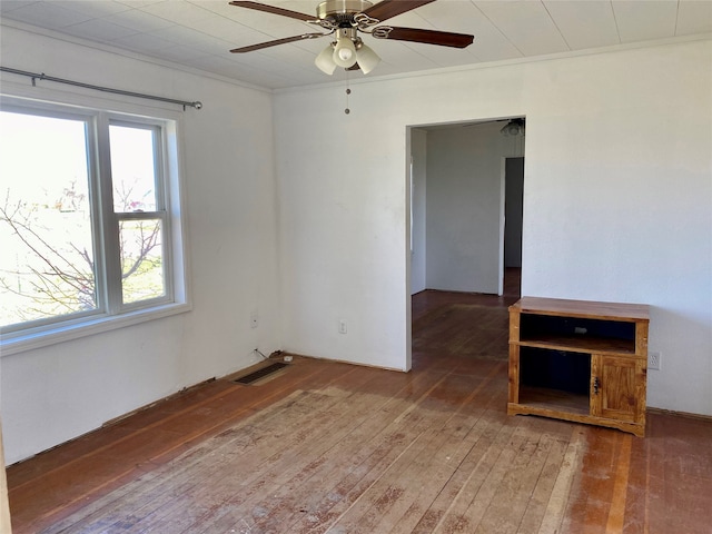 empty room with dark wood-type flooring and ceiling fan