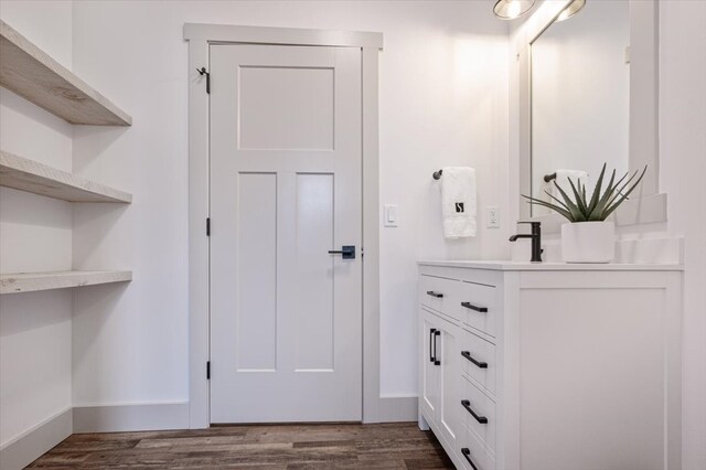 bathroom with vanity and hardwood / wood-style flooring