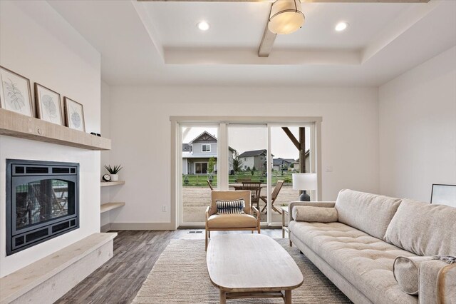 living room with ceiling fan and dark hardwood / wood-style floors