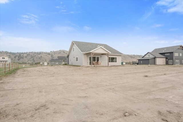 rear view of property with a mountain view