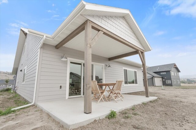 back of house with a patio