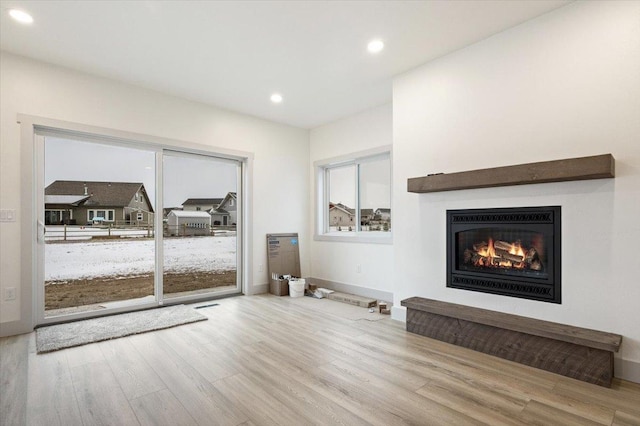 unfurnished living room featuring light wood-type flooring