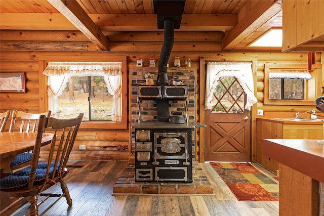 interior space featuring wooden ceiling, beam ceiling, and hardwood / wood-style floors