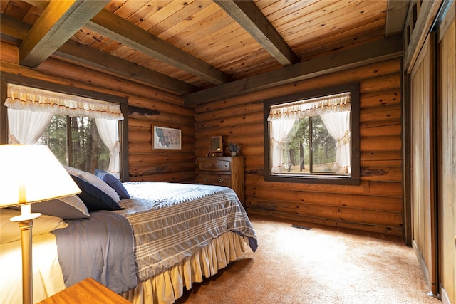 bedroom featuring beamed ceiling, wooden ceiling, and log walls